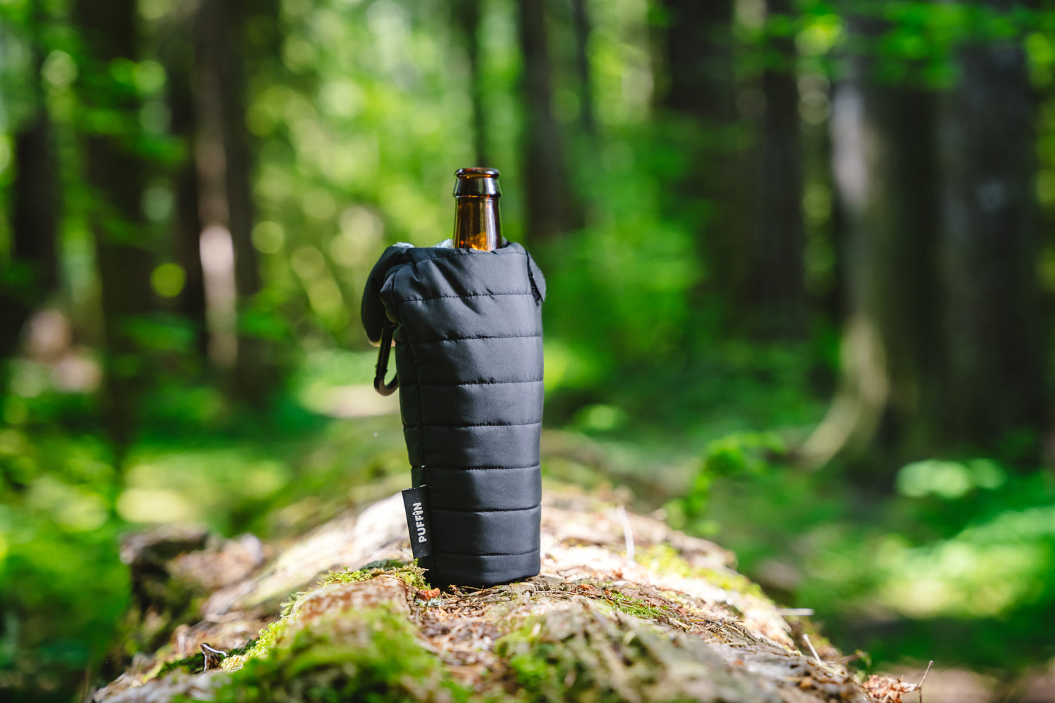 Beer bottle in cooler sleeve