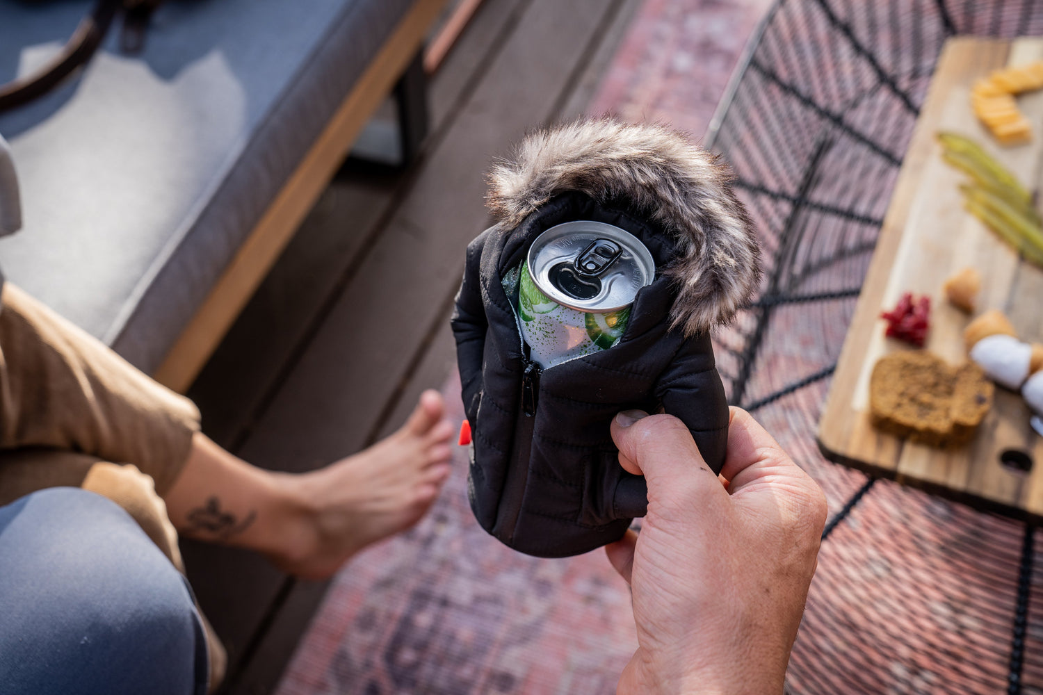 Woman Holding a Tall Can Koozie-Type Beer Jacket