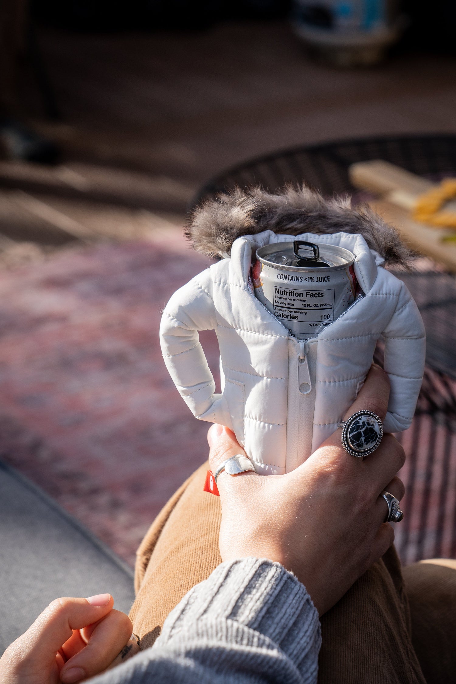 Person Holding a Tall Can Beer Jacket