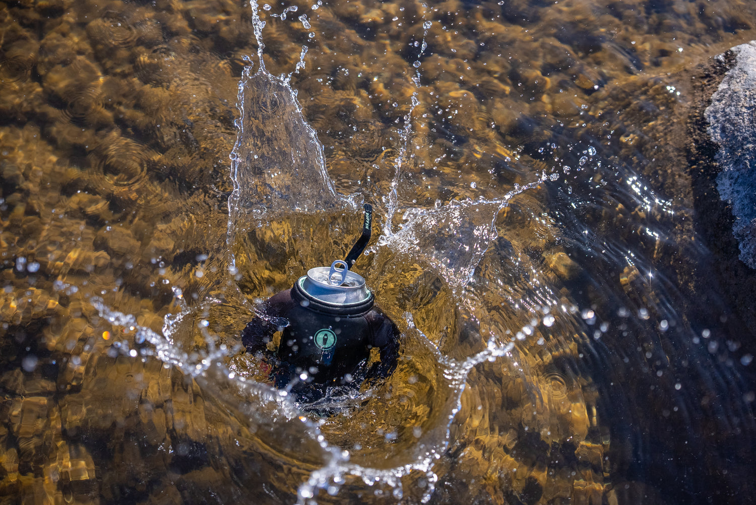 The Dawn splashing into the water - Puffin Drinkwear drink sleeves